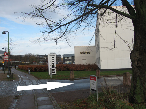 Turn right at Fitness World (follow the arrow)